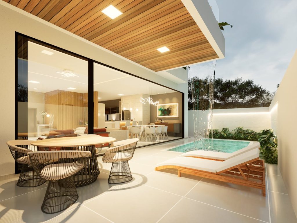 Elegant Brazilian patio with outdoor seating, pool, and modern architecture.